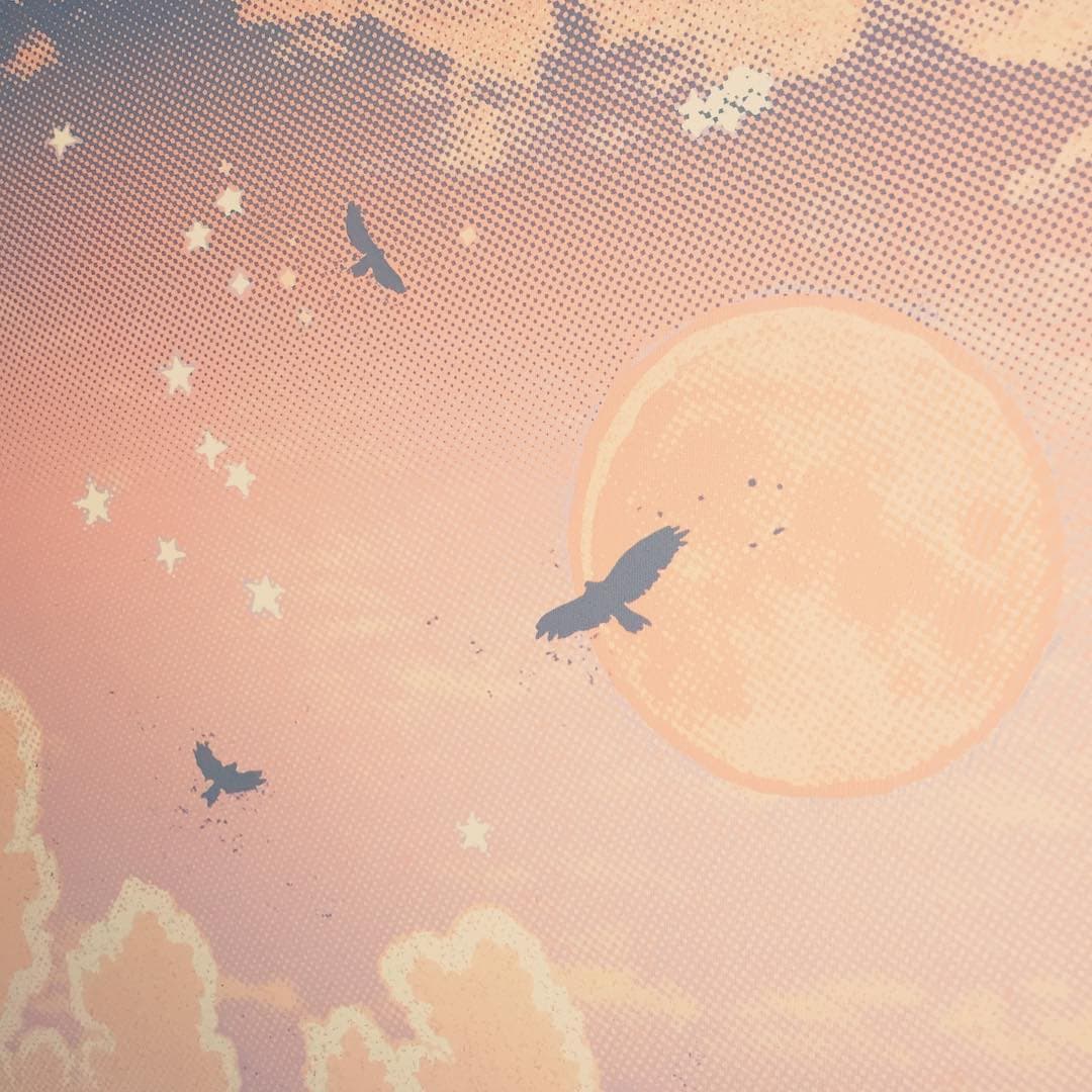 Closeup of a screen print depicting a spaceship orbiting a red planet