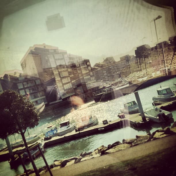 Juno beach dock with boats and hotels